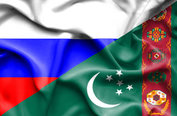 wellenfahne von turkmenistan und russland - turkmenistan stock-grafiken, -clipart, -cartoons und -symbole
