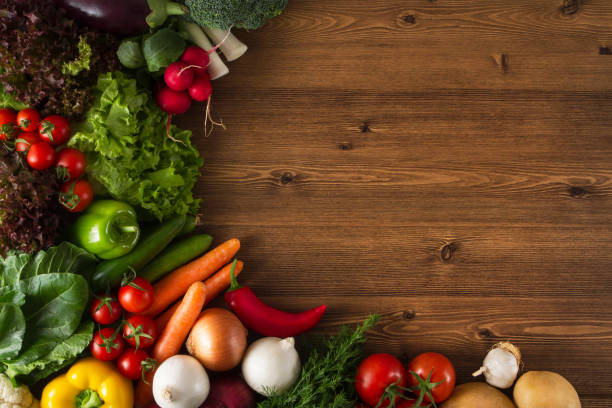 istock Healthy Organic Vegetables on a Wooden Background 670120236