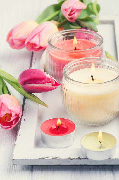istock Yellow and pink aroma candles with tulips 670120492