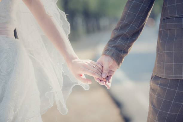 istock Love - romantic couple holding hands, beach sunset 670120866