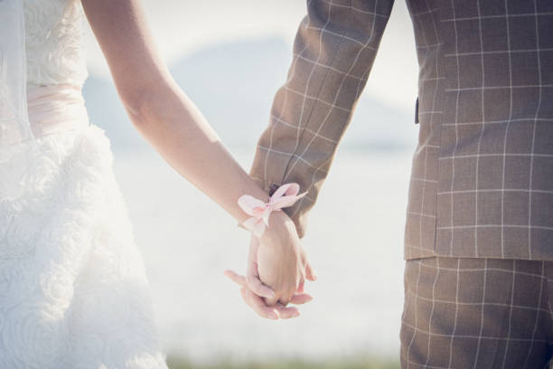 istock Love - romantic couple holding hands, beach sunset 670123030