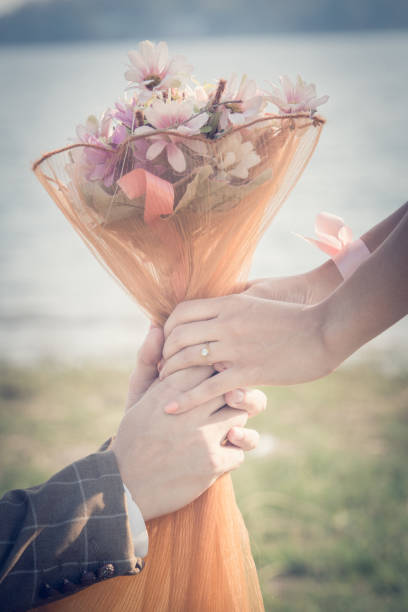 istock Love - romantic couple holding hands, beach sunset 670123078