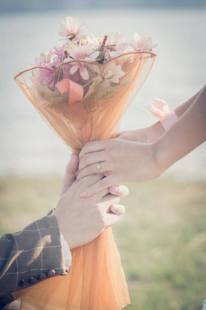 istock Love - romantic couple holding hands, beach sunset 670123234