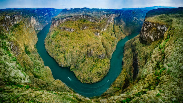 Sumidero Canyon in Chiapas Mexico Panoramic Aerial view of Sumidero Canyon in Chiapas, Mexico. mexico chiapas cañón del sumidero stock pictures, royalty-free photos & images
