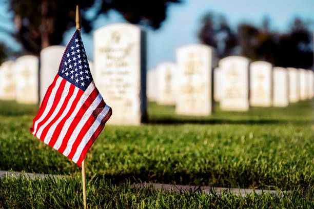 Patriotic 1 A flag on a grave at a southern California cemetery. cemetery stock pictures, royalty-free photos & images