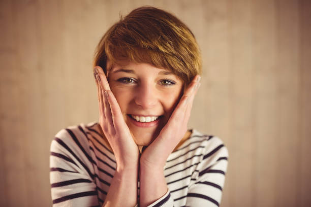 istock Young smiling woman smiling at camera 670131270