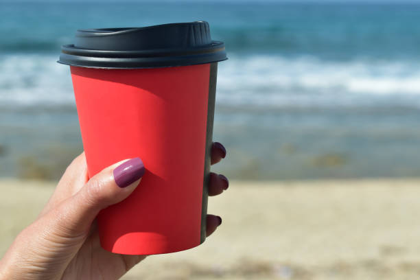 istock woman holding a coffee 670134212