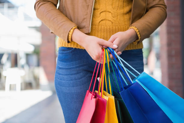 istock Woman holding shopping bags 670134256
