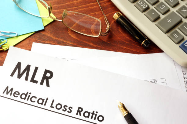 istock Document with title Medical Loss Ratio (MLR) in an office. 670136570