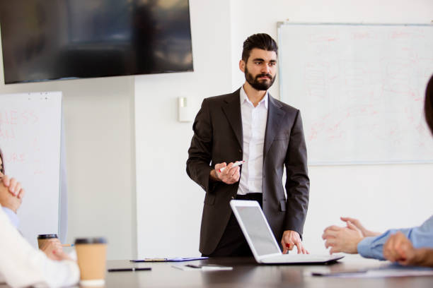 istock Young businessman holding a presentation in the office 670137122