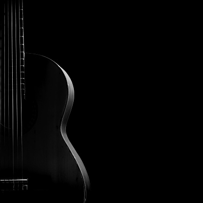 Extreme Close up shot of an electric guitar in Black and White - selective focus