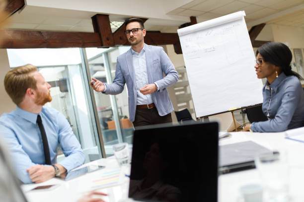 istock Businessman presenting new project to partners in the office. 670140238