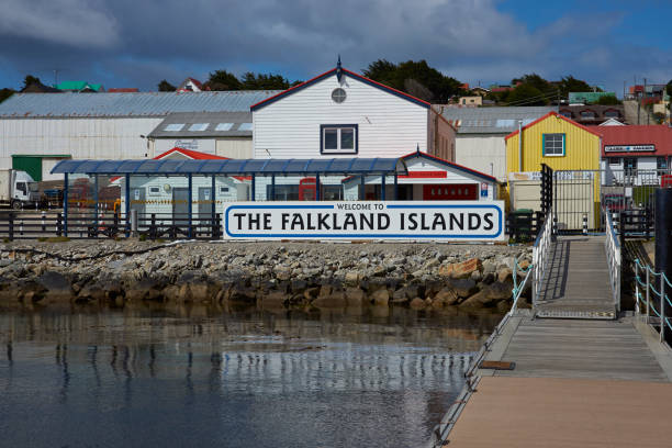 Welcome to the Falkland Islands Jetty used by visitors arriving by sea in Stanley, capital of the Falkland Islands. falkland islands stock pictures, royalty-free photos & images