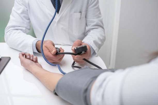 istock Doctor measuring pressure 670151162