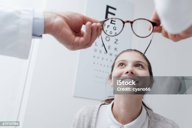 Happy Woman Trying Her New Glasses Stock Photo - Download Image Now - Myopia, Eye Exam, Optometrist