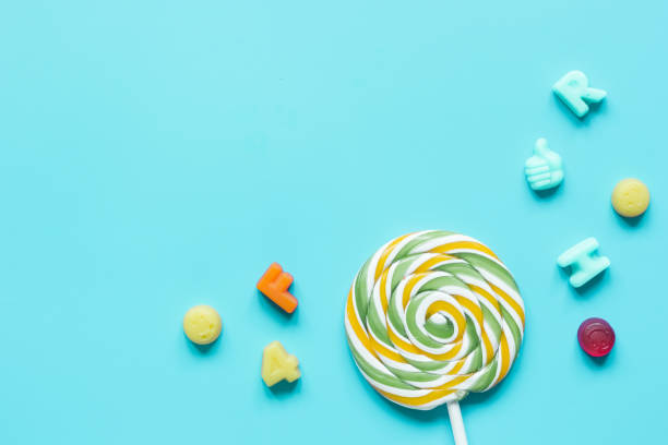 istock sweets and sugar candies on blue background top view mock-up 670151246