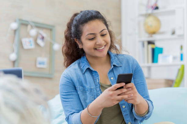 istock College girl texts with a friend 670155022