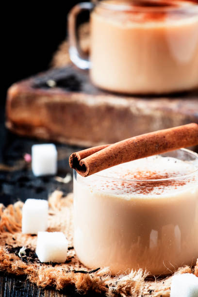 istock Black tea with milk, sugar and cinnamon 670167850