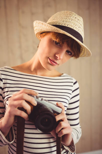 istock Pretty woman photographing with camera 670168606