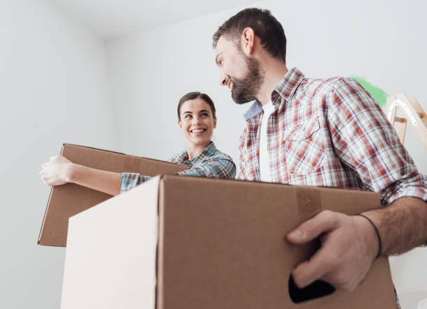 istock Young couple moving into a new house 670168744