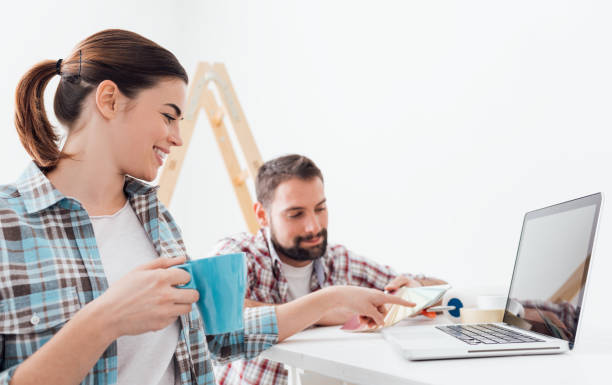 istock Couple choosing paint colors 670169022
