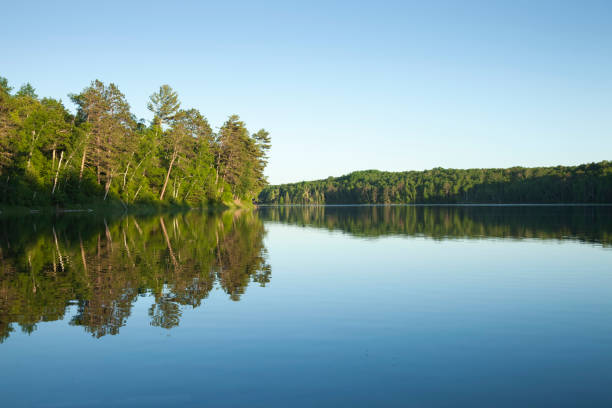 istock Calm northern Minnesota lake in afternoon sunlight 670183804