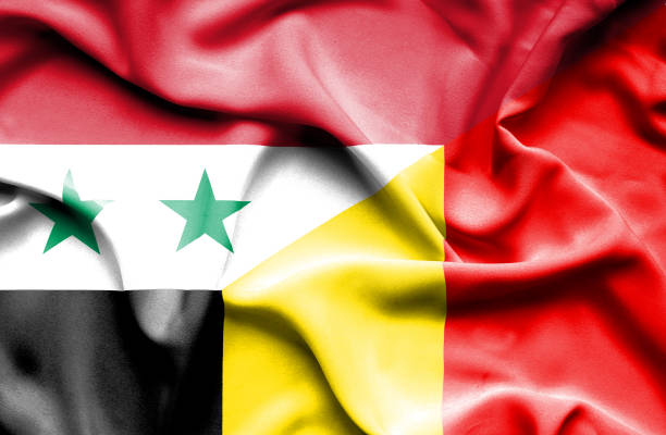 istock Waving flag of Belgium and Syria 670187630