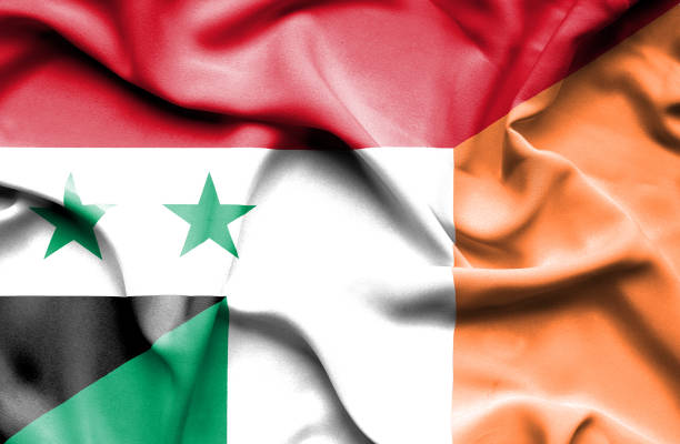 istock Waving flag of Ireland and Syria 670187838