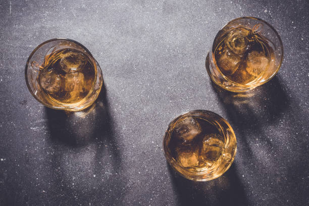 istock Glasses of whiskey on gray stone background. 670192358