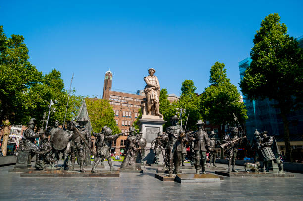 Nightwatch sculptures under the Rembrandt statue at Rebrandtsplein in Amsterdam