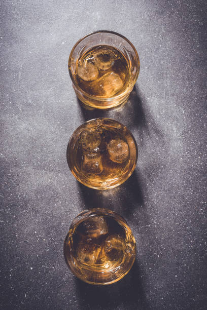 istock Glasses of whiskey on gray stone background. 670196416