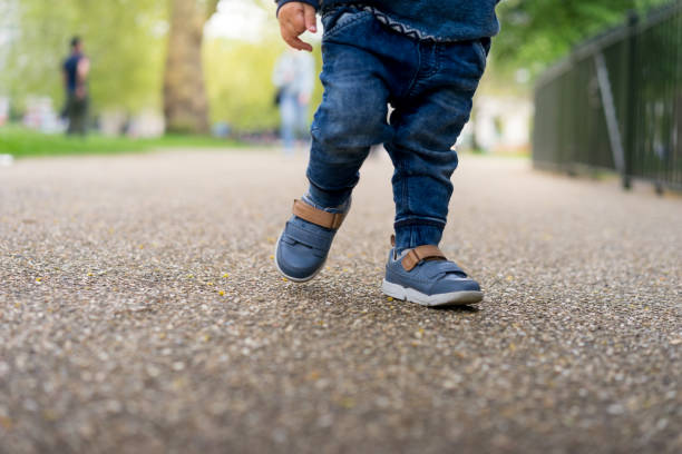 istock Asian baby first walk in the park 670202490
