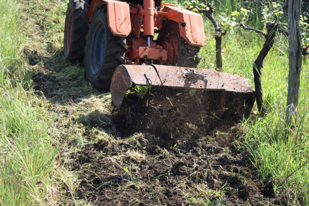 istock plowing of the soil with old rotary hoe 670202850