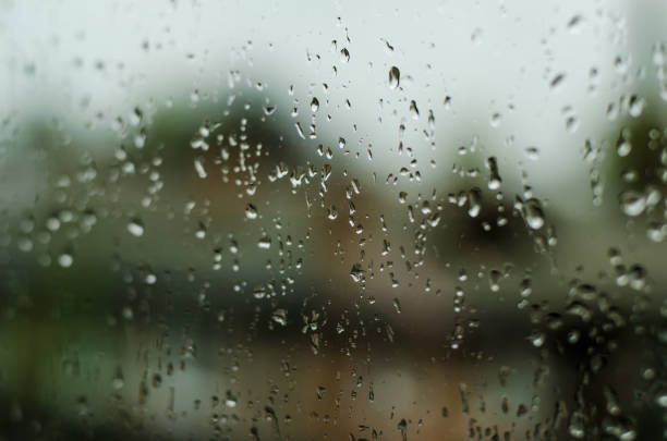 istock Rainy days,Rain drops on window,rainy weather,rain background,rain and bokeh 670203528