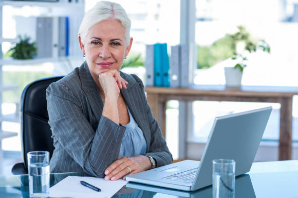 istock Happy businesswoman looking at camera 670210424