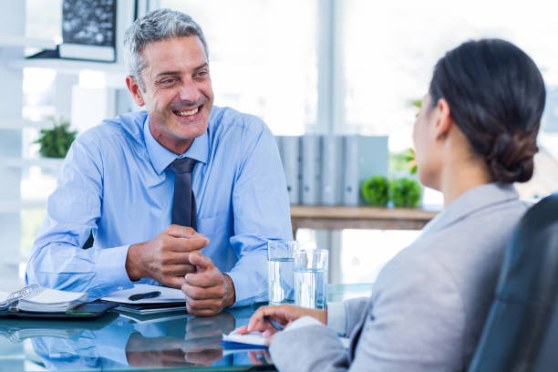 istock Happy business people speaking together 670212694