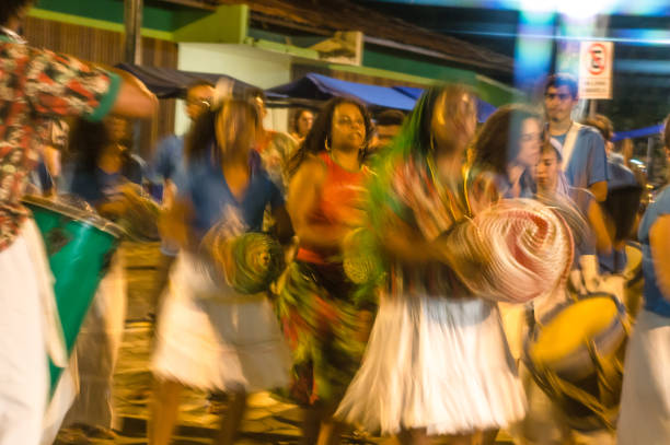 Courtship of maracatu - traditional folk dance with African roots - with the Batuki Kianda group in Ilhabela, Brazil, on April 16, 2017, walking the streets of the historic city center. stock photo