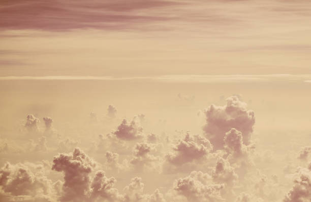 Skyline View above the clouds from air plane with retro effect