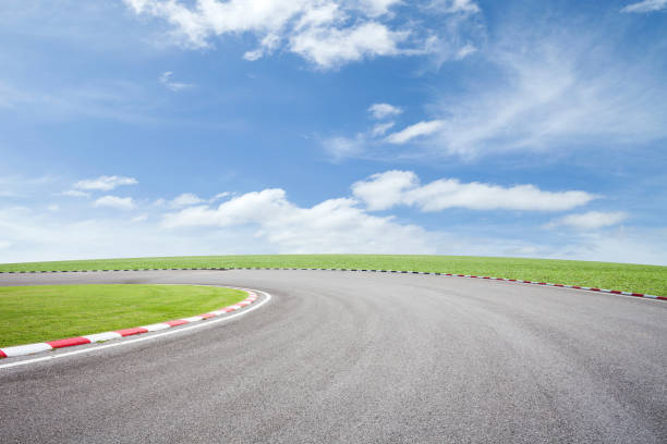 istock empty asphalt road with green grass on sky background. 670225302