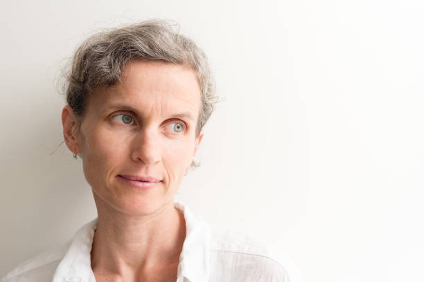 istock Middle aged woman with grey hair 670229884