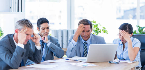 istock Thoughtful business people during meeting 670232748