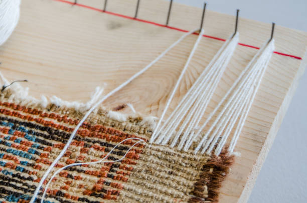 istock Rug fringe repairing process 670239988