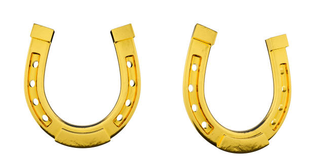 ferro di cavallo d'oro su sfondo bianco - horseshoe gold good luck charm symbol foto e immagini stock