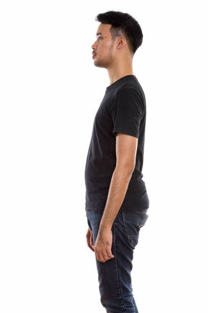 istock Profile view of young Asian man standing 670246858
