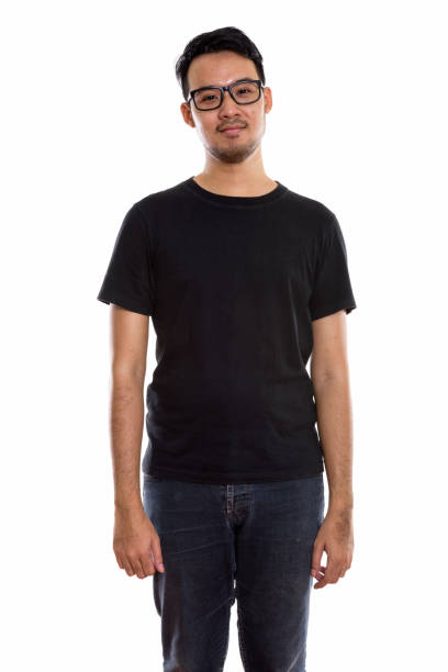istock Studio shot of young Asian man standing while wearing eyeglasses 670246918