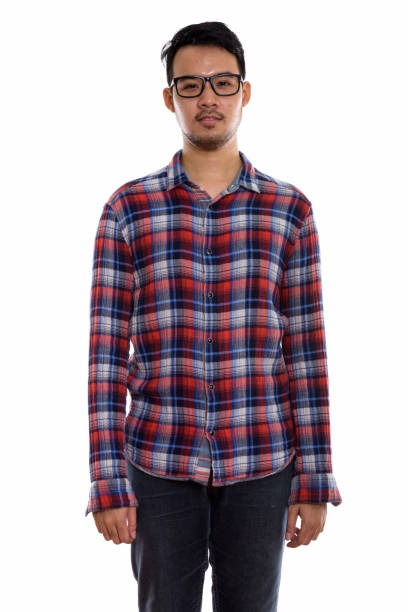 istock Studio shot of young Asian man standing while wearing eyeglasses 670246966