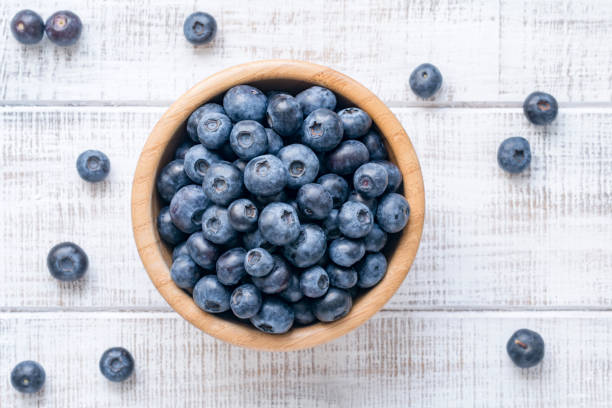istock Top view of fresh blueberries in bowl 670247782