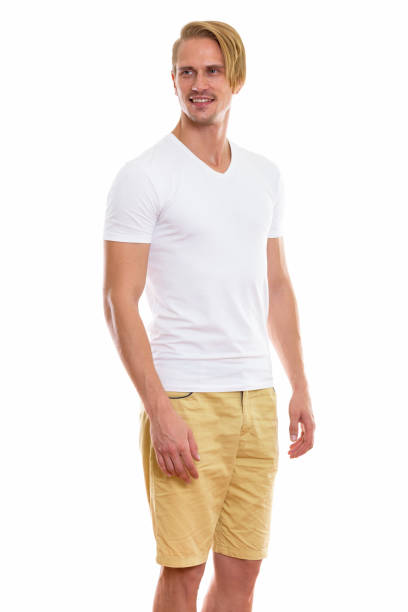 istock Studio shot of happy young handsome man smiling and standing while thinking 670254890