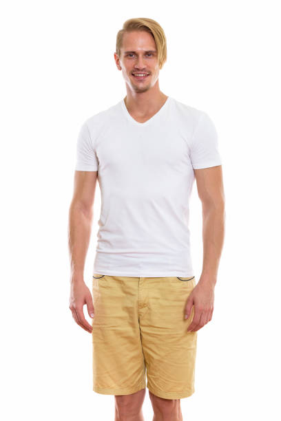 istock Studio shot of happy young handsome man smiling while standing 670254912