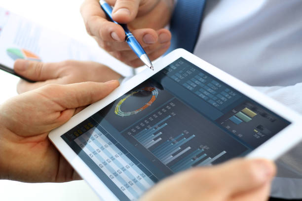 istock Business colleagues working and analyzing financial figures on a digital tablet 670254960
